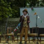 man in costume on stage at Literary Festival