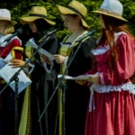 performers in costume on stage