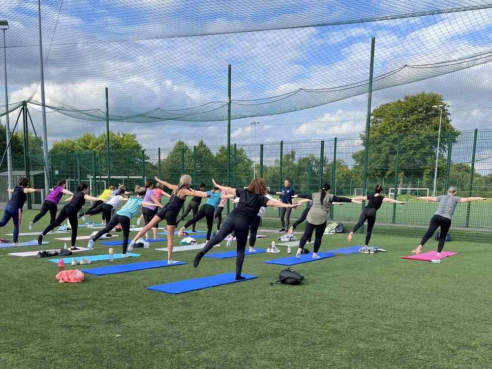 people doing their Yoga practise outside