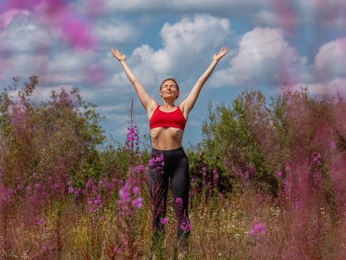 Marta Yoga instructor out in a meadow