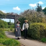 Couple in period dress in the walled garden