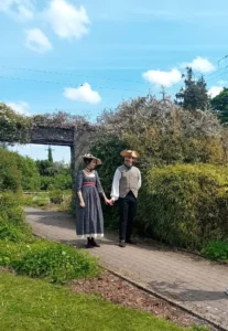 Couple in period dress in the walled garden