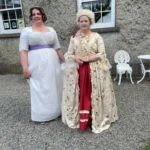 Tow ladies in period dress outside the Maria Edgeworth Centre