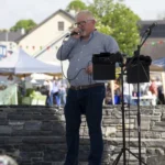 Peter Costello performing on stage