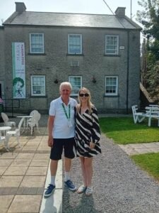 Chelsey Harrington and Matt Farrell in front of Maria Edgeworth Centre outdoor on the 2025 Great Aviva Road Trip