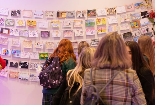 students viewing the postcard exhibition