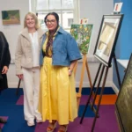 Three women at an art Exhibition