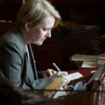British ambassador Kara Owen signs the guestbook at the Maria Edgeworth Centre