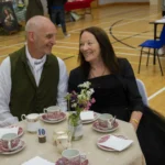 Two people in costume at the 18th Century Tea Party