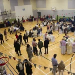 Guests in costume enjoy tea at the 18th Century Tea Party