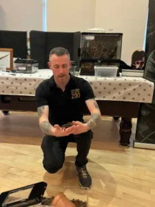 Man with tarantula spider from the Midlands Bug and Reptile Zoo