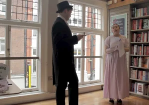 Two actors performing a scene from Belinda